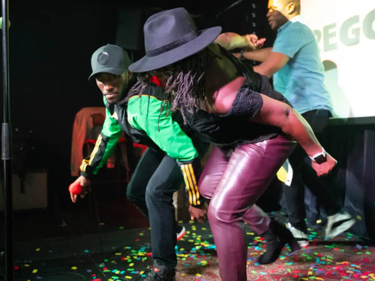 Caribbean karaoke performance with singers on stage in London